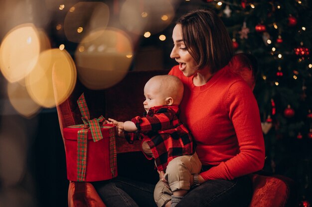 Mother with her baby boy celebrating christmas