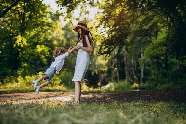 Mother with her son having fun in park