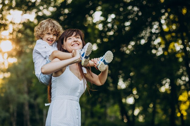 Mother with her son having fun in park