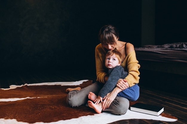 Mother with her son playing in the room