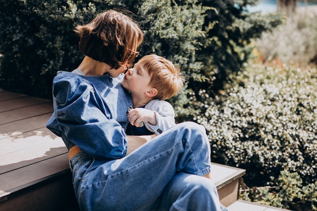 Mother with her son sitting on the stairs