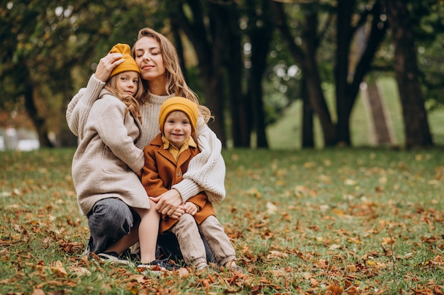 Free photo mother with kids having fun in park