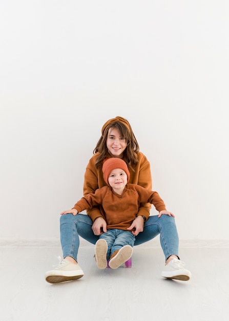 Mother with little boy on skateboard