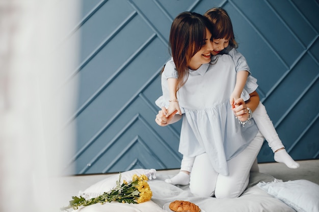 Mother with little child at home