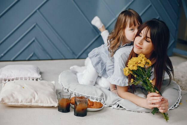 Mother with little child at home