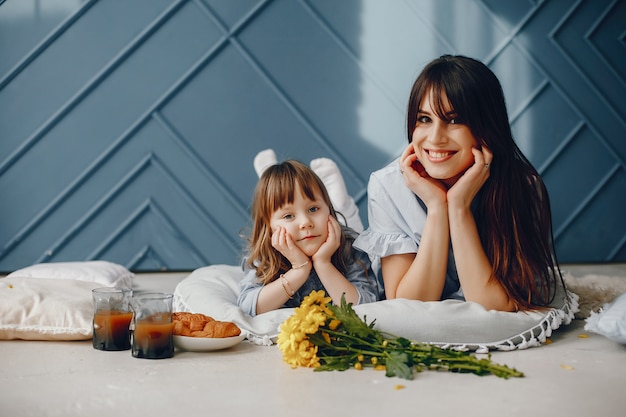 Mother with little child at home