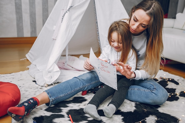 Mother with little daughter at home