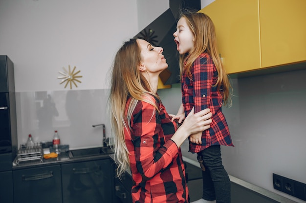 Mother with little daughter at home