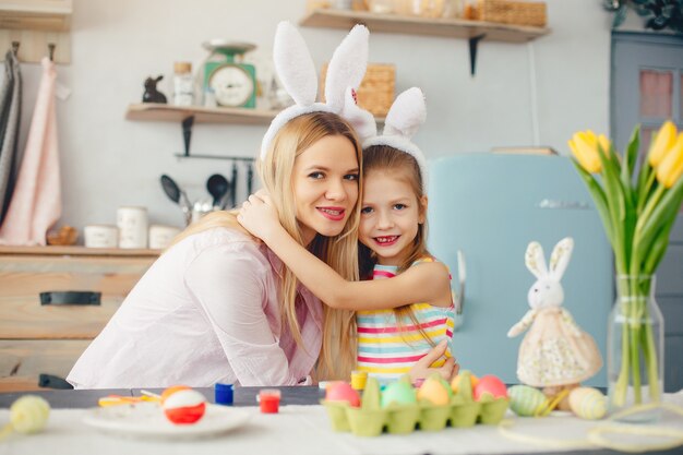 Mother with little daughter in a kitchen