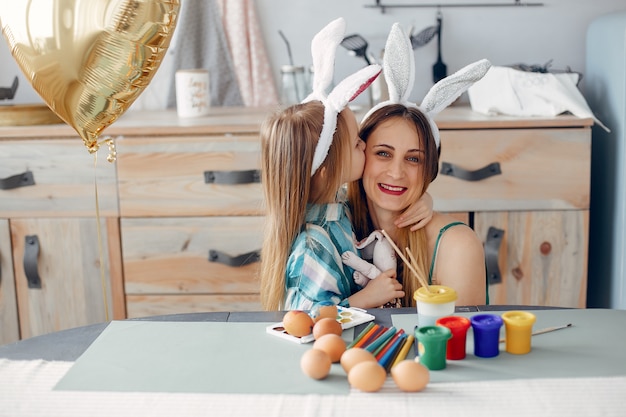 Mother with little daughter in a kitchen