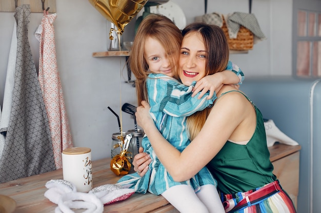 mother with little daughter in a room