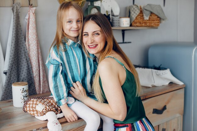 mother with little daughter in a room