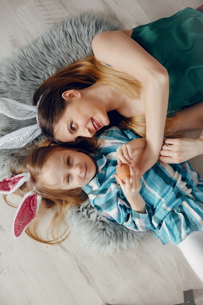 Mother with little daughter in a room