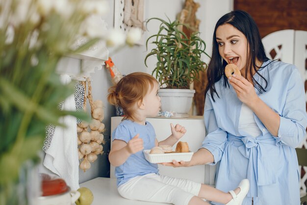 Mother with little daughter in a room