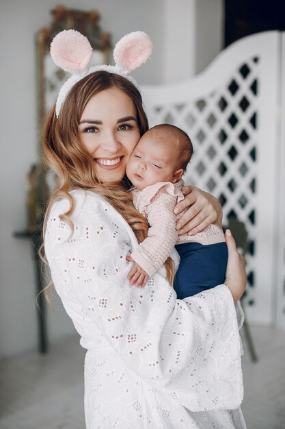 Mother with little daughter in a room