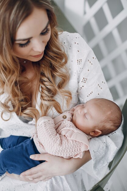 Mother with little daughter in a room