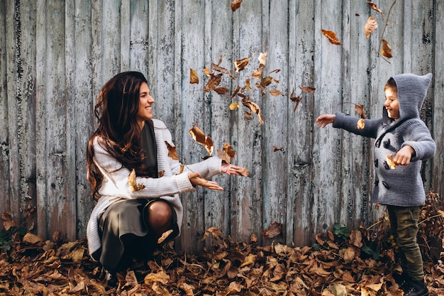 Mother with little son in an autumn park