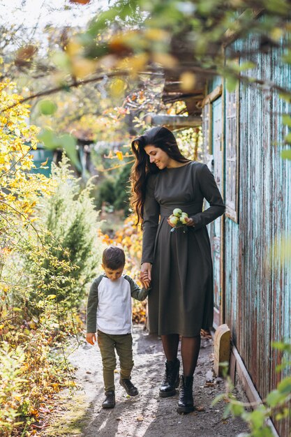 Mother with little son in an autumn park