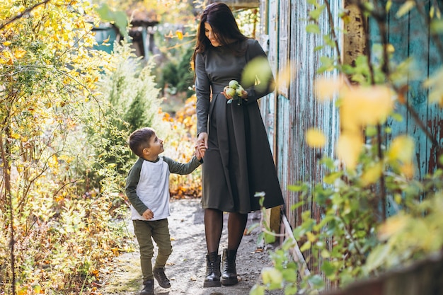 Mother with little son in an autumn park