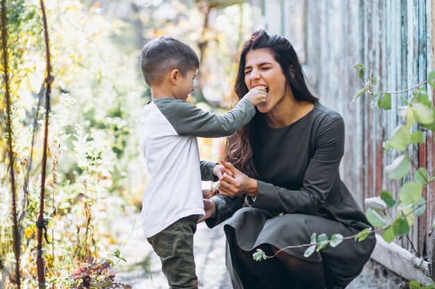 Mother with little son in an autumn park