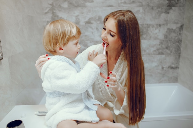 Mother with little son in a bathroom