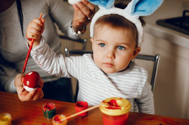 Mother with little son in a kitchen