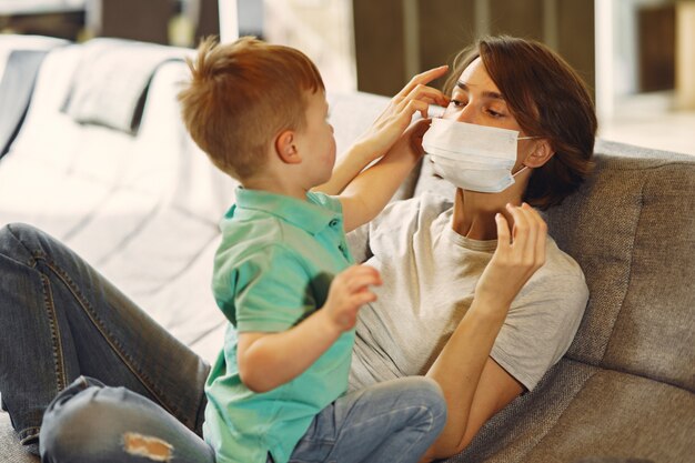 Mother with littler son sitting at home on quarantine