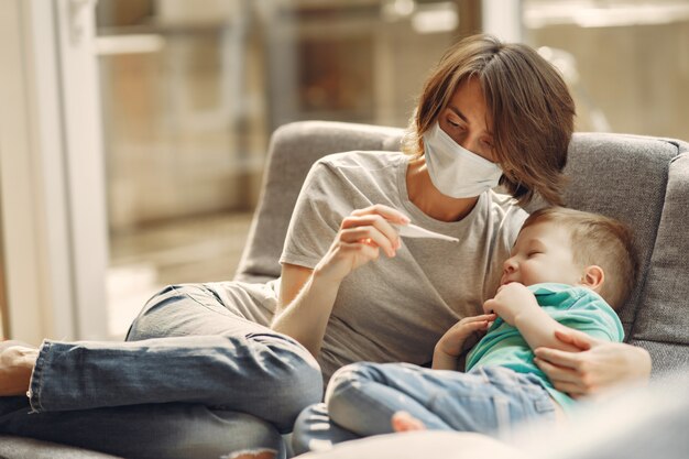 Mother with littler son sitting at home on quarantine