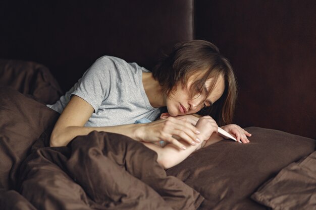 Mother with littler son sitting at home on quarantine