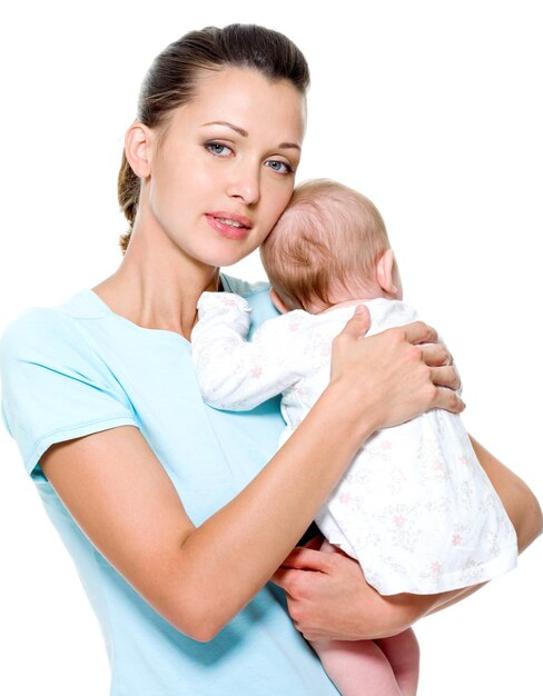 mother with  newborn child on hands