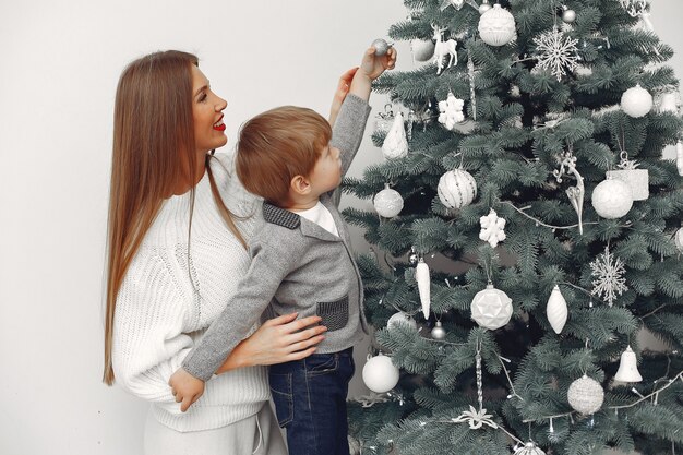 Mother with son in a Christmass decorations