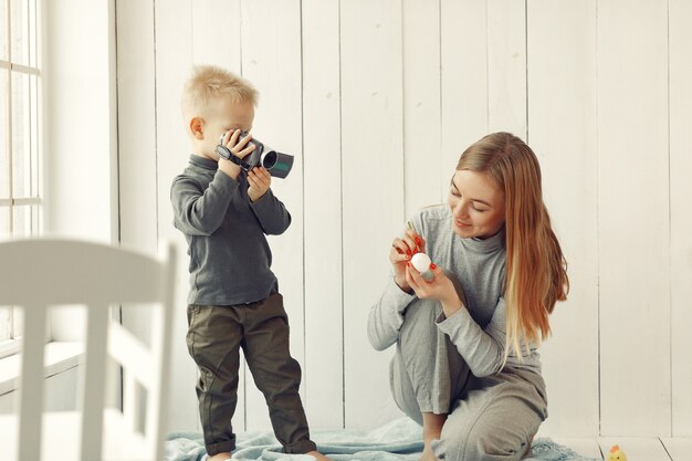 Mother with son at home prepare to easter