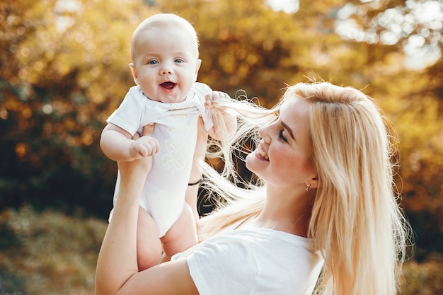 Mother with son playing in a summer park