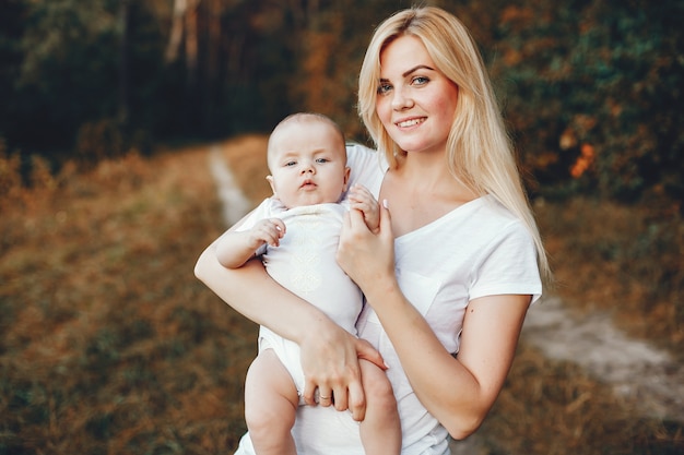 Mother with son playing in a summer park