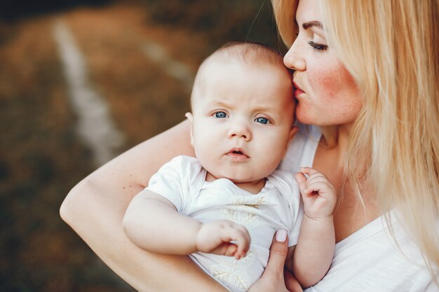 Mother with son playing in a summer park