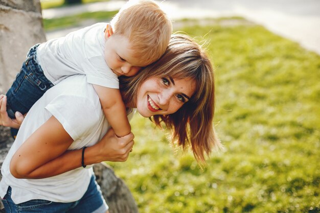 Mother with son playing in a summer park