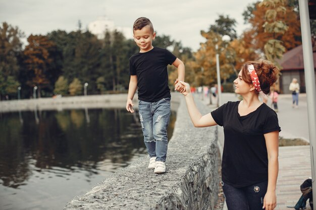 Mother with son playing in a summer park