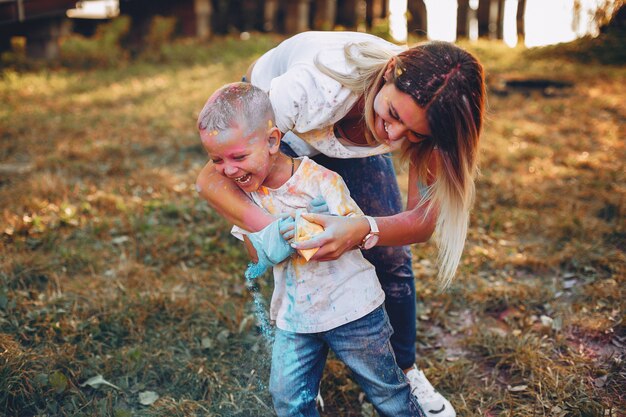 Mother with son playing in a summer park