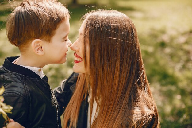 Mother with son playing in a summer park