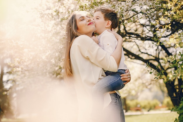 Mother with son playing in a summer park