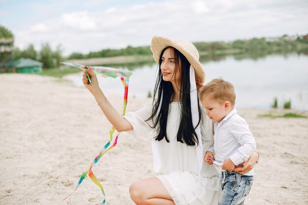 Mother with son playing in a summer park