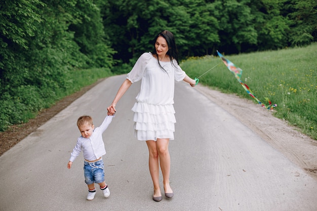 Mother with son playing in a summer park