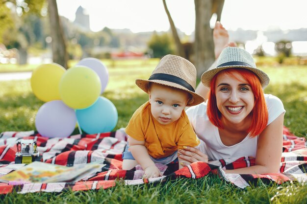 Mother with son playing in a summer park