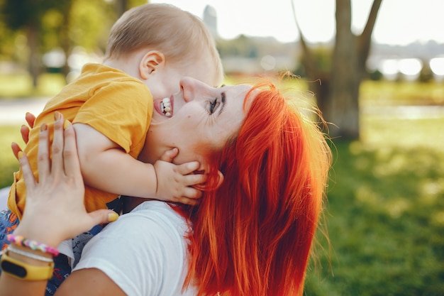 Mother with son playing in a summer park