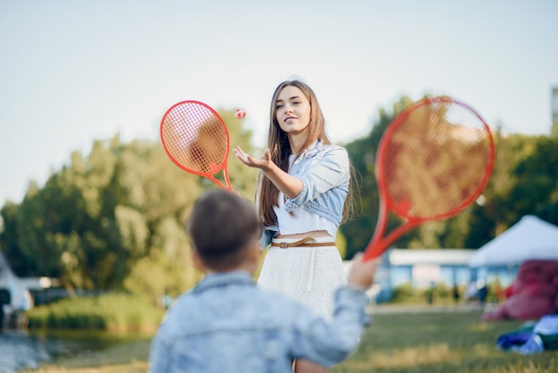 Mother with son playing in a summer park