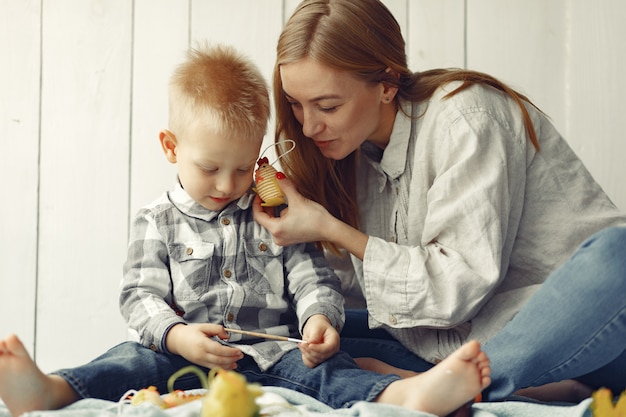 Mother with son preparing to easter at home