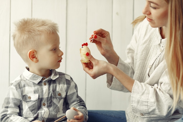 Mother with son preparing to easter at home