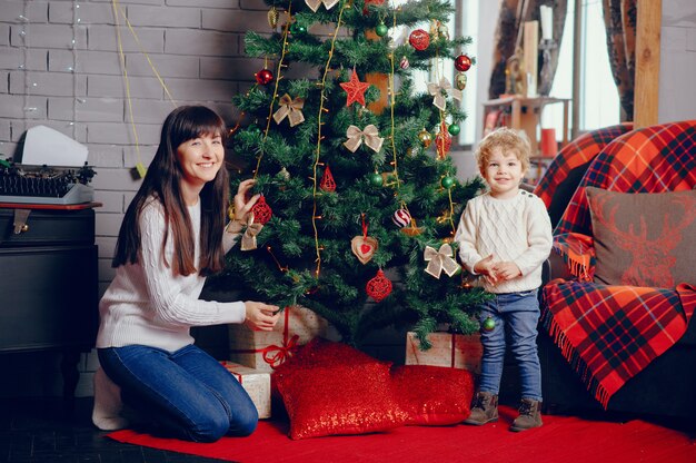 Mother with son sitting at home