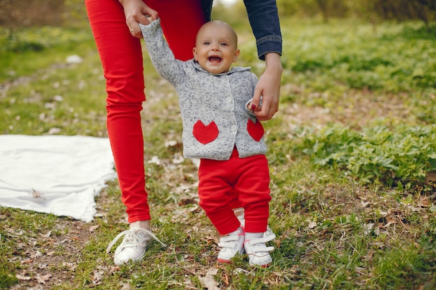 Free photo mother with son in a spring park