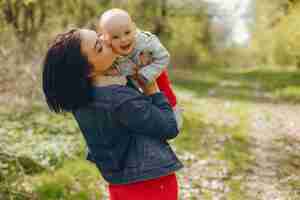 Free photo mother with son in a spring park